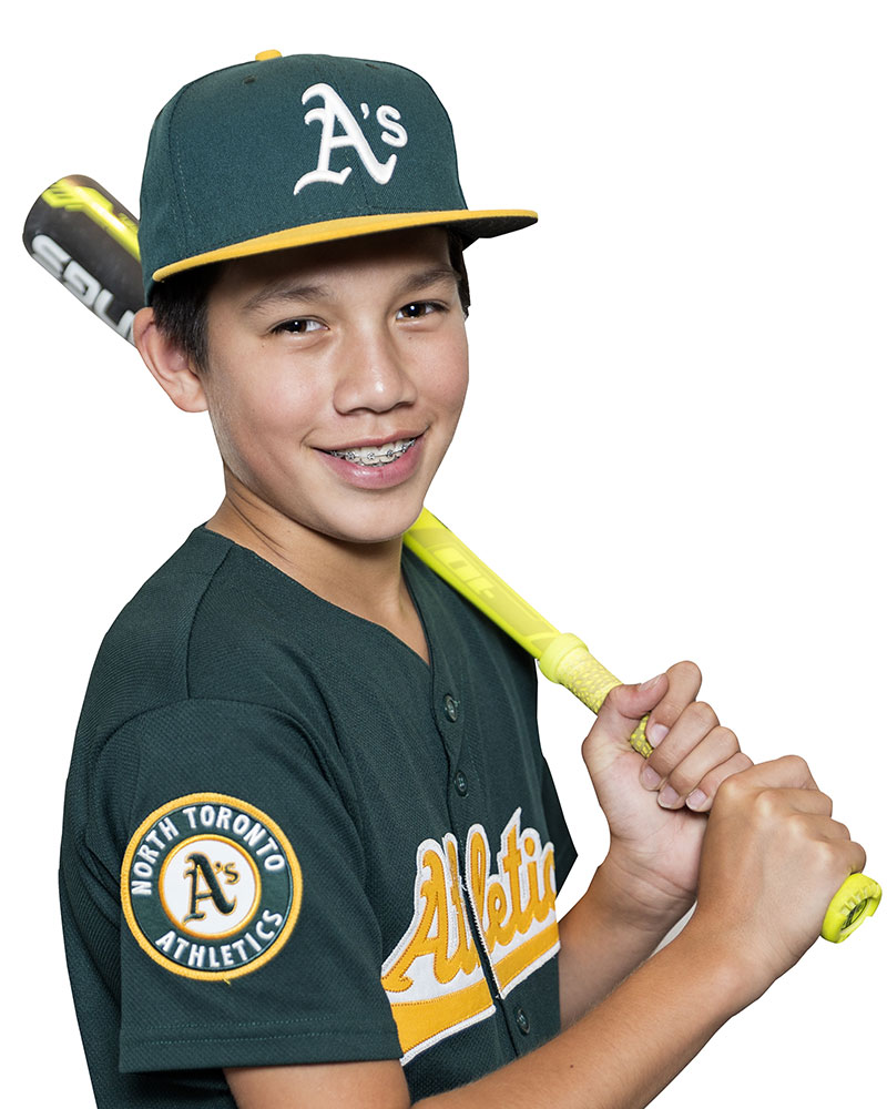 Boy with braces holding bat